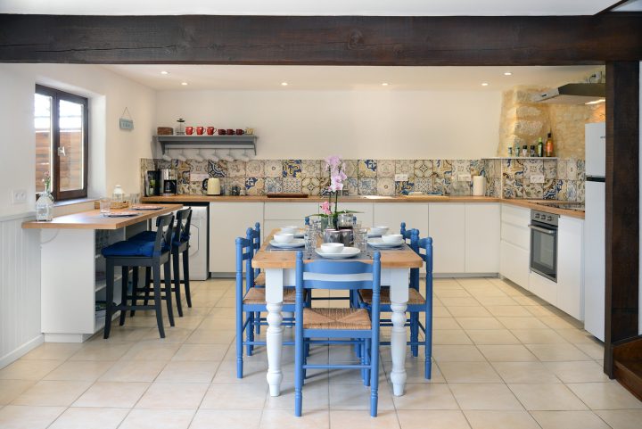 Kitchen, dining and bar seating area