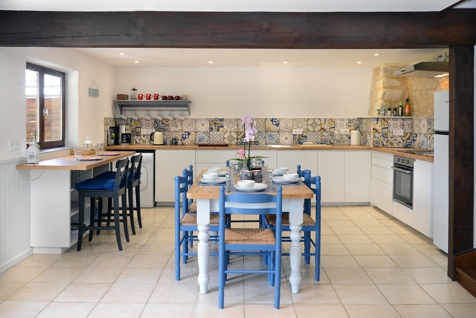 Kitchen, dining and bar seating area